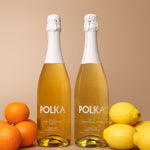 polka non alcoholic yuzu mandarin spritz and limoncello spritz on plain background 