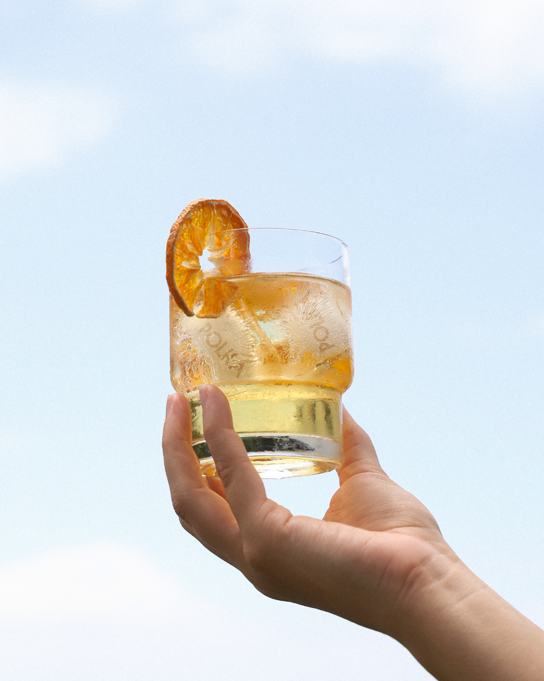 Bottle of Polka De-Alc Yuzu & Mandarin Spritz, citrus-forward non-alcoholic aperitivo